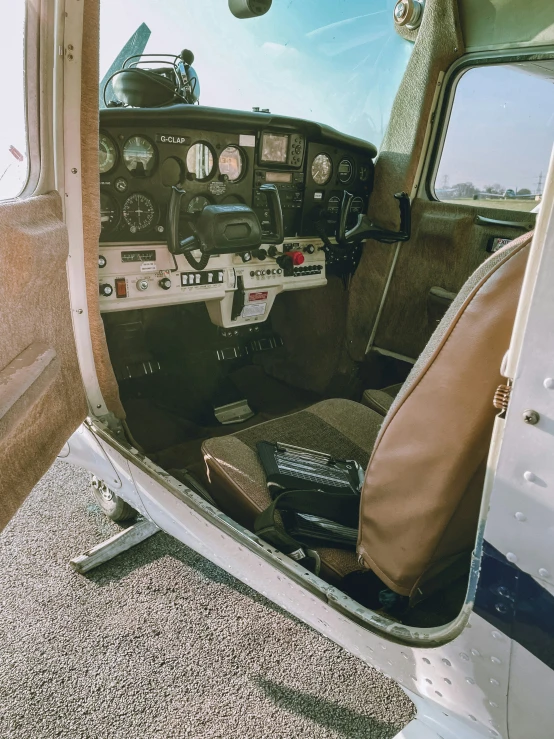 a plane cockpit filled with many pieces of luggage