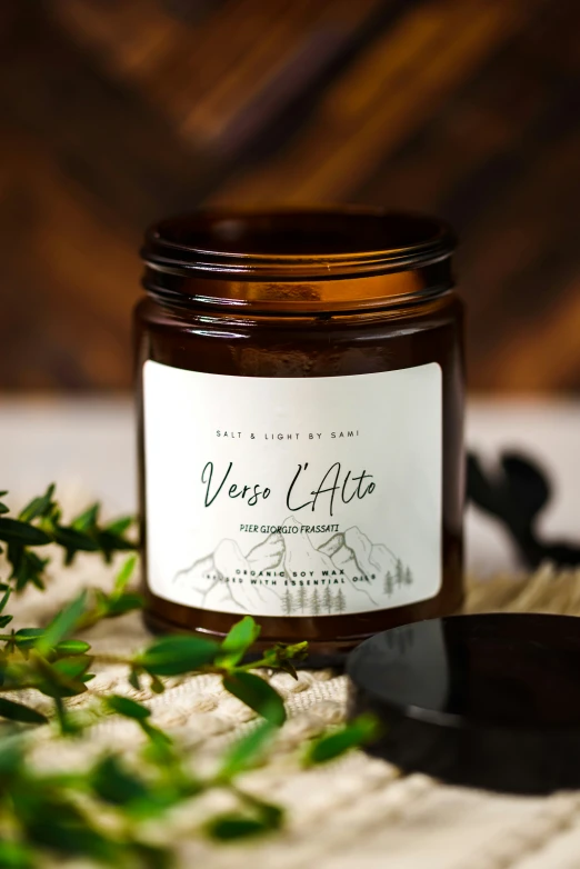 a jar of fresh lavender with rosemary on a table