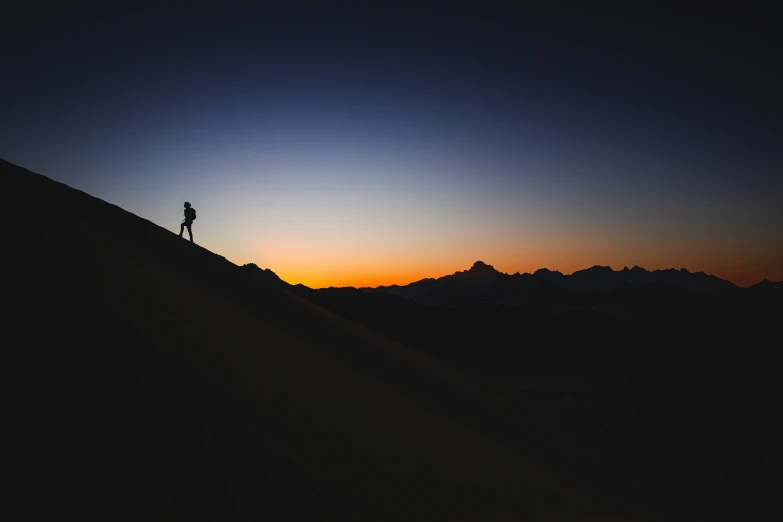 a man standing on top of a mountain