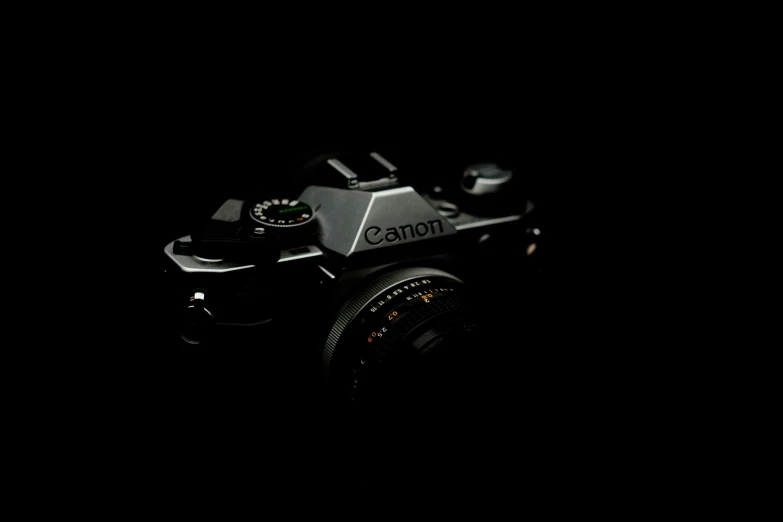 a camera is pographed against a dark black backdrop