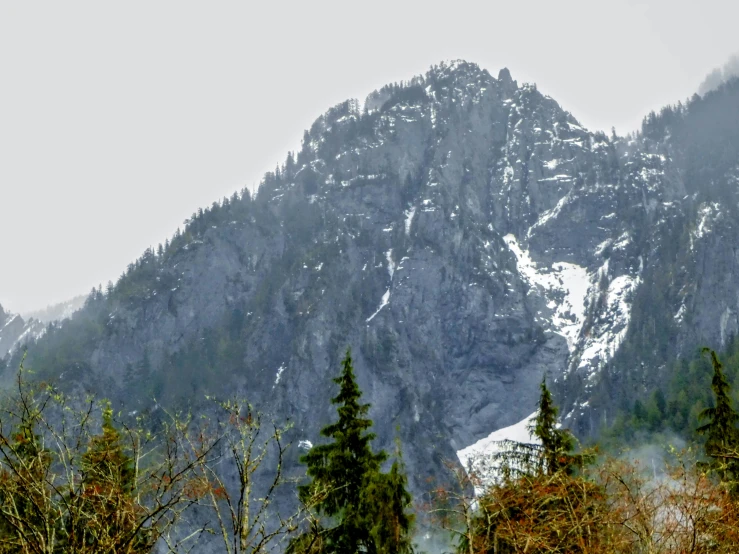 a snow capped mountain rises in the distance