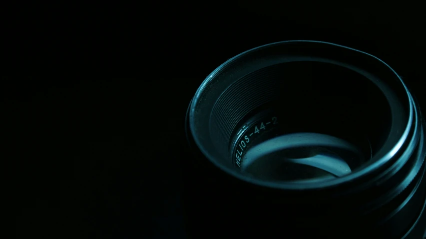 a black mug sitting on top of a table