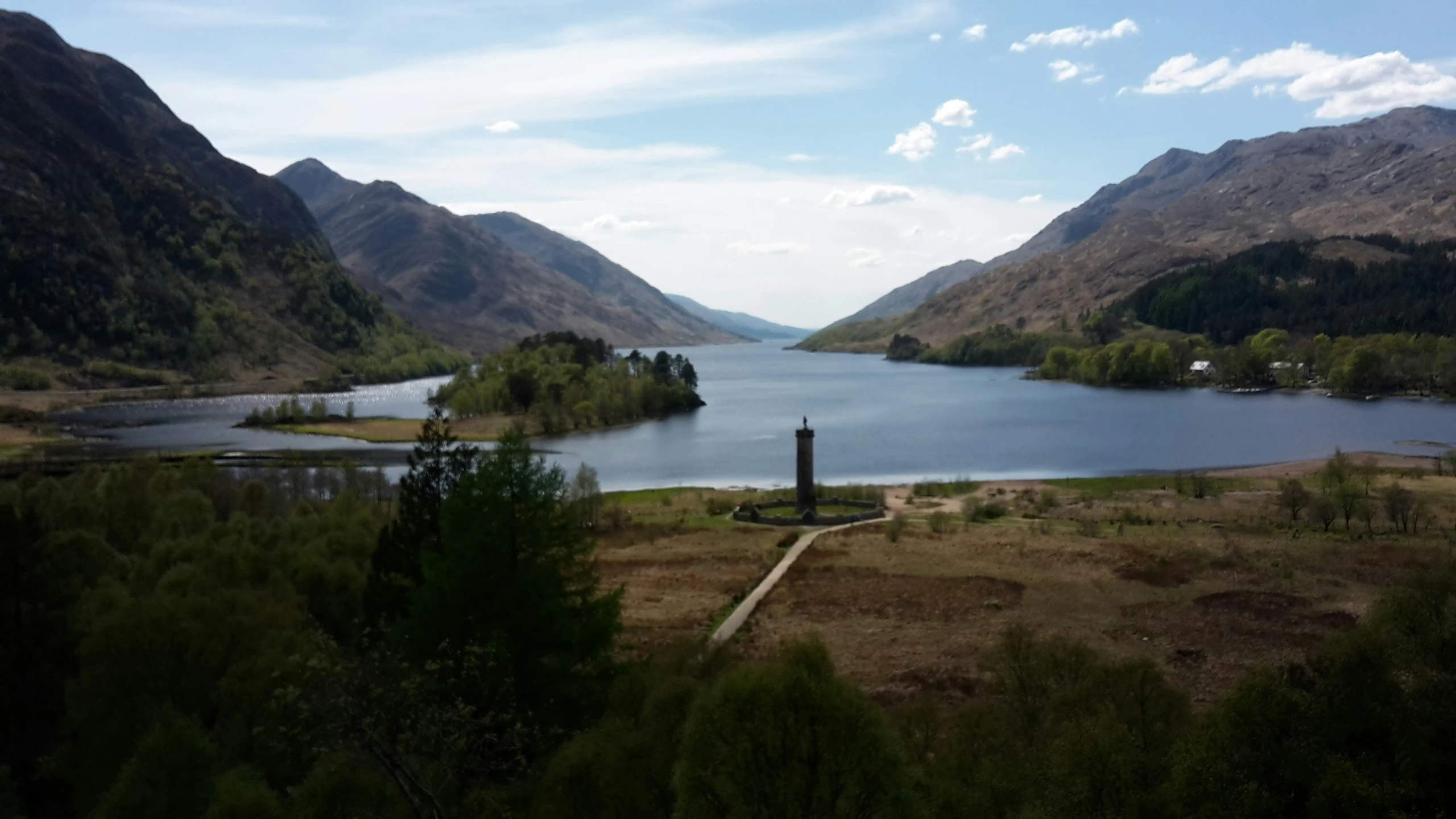 a view of a large lake surrounded by mountains