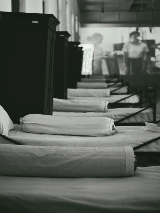 many folded blankets are laying on a floor