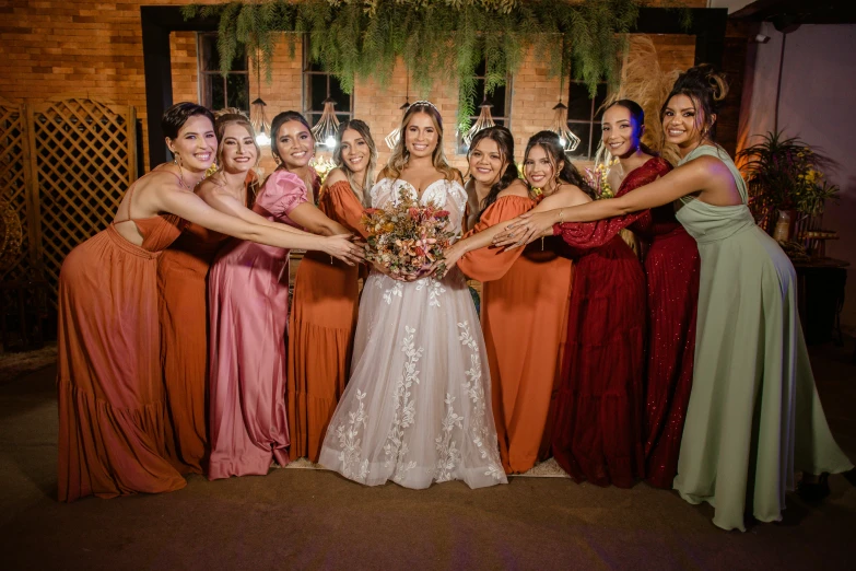 this bride and her bridesmaids are smiling together