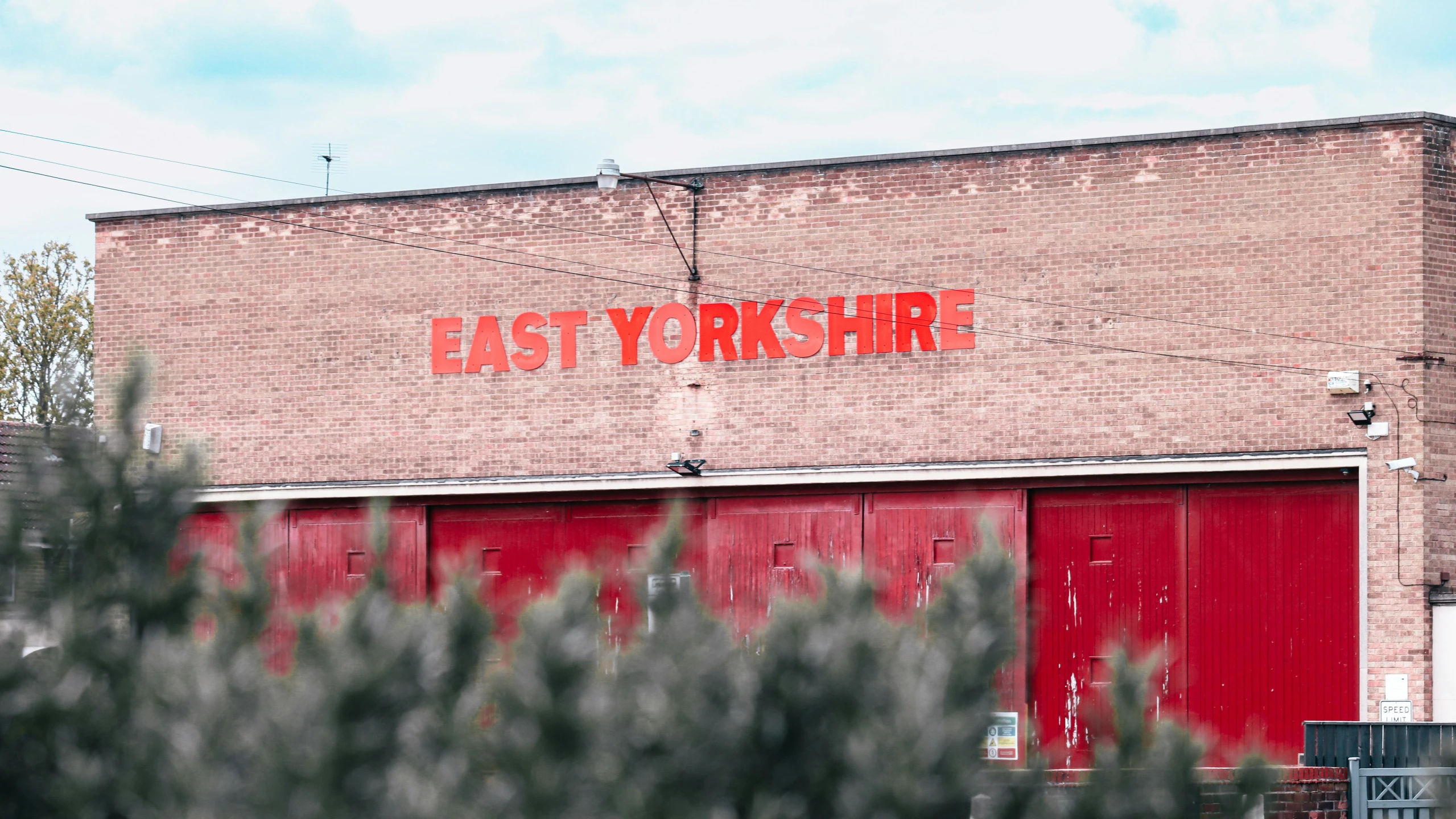 an old brick warehouse building with a large sign reading east york