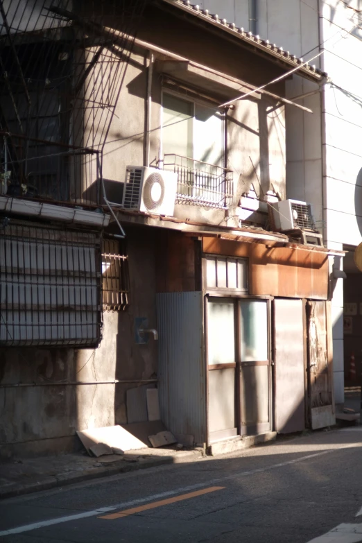 a row of abandoned buildings near an old city street