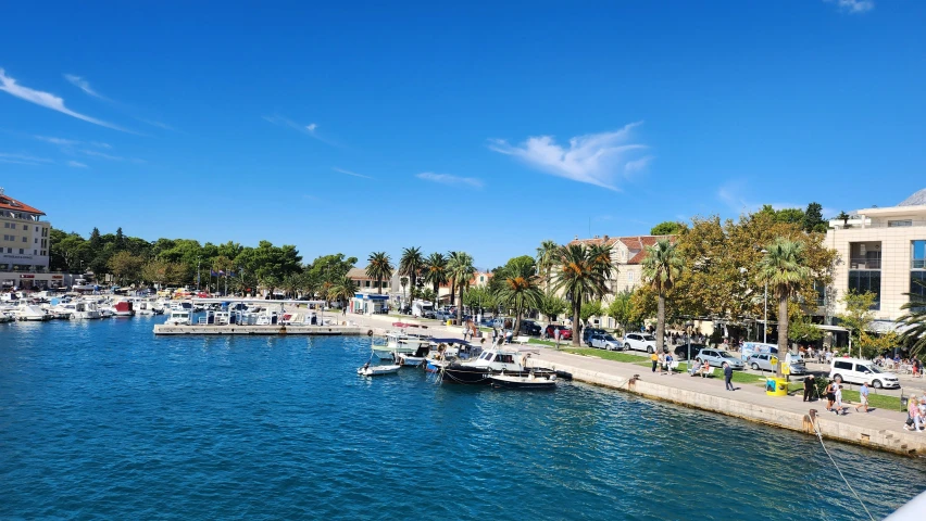 the water has small boats and buildings on it