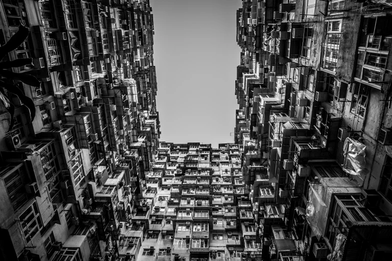 black and white image of apartment buildings in an urban area