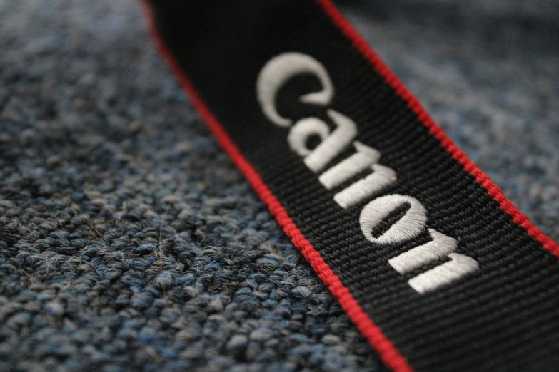 a small logo on a blue, gray and red tie
