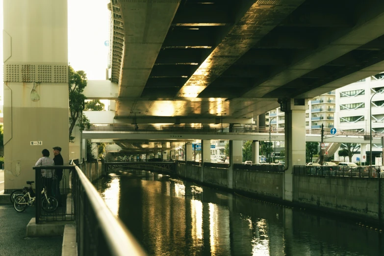 a street scene with a bridge over water