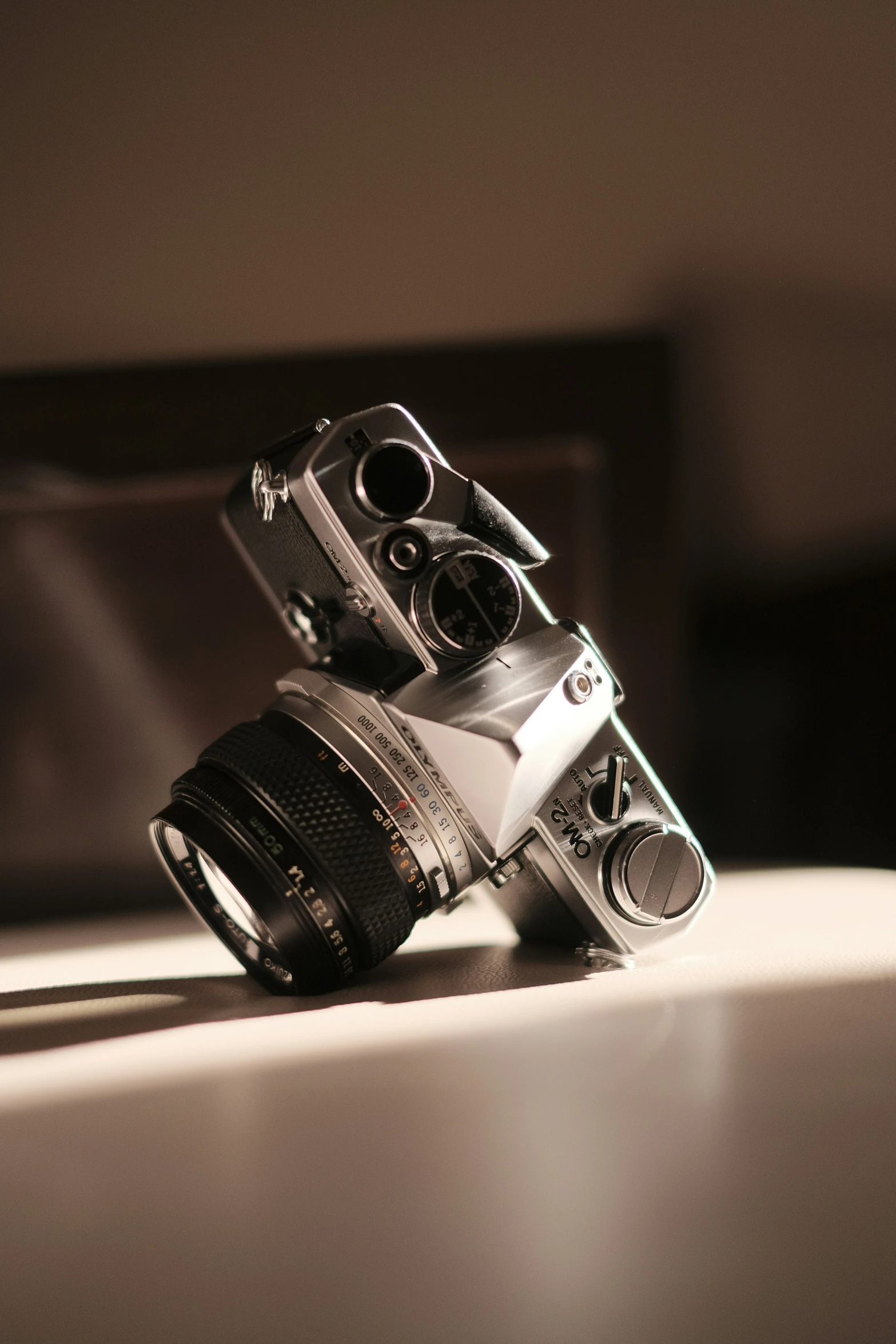 an old camera sitting on top of a table