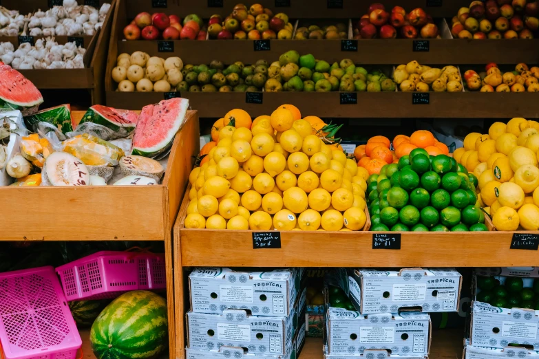 different types of fresh fruit on display in a grocery store