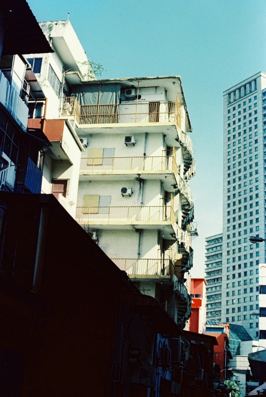 a picture taken from the back side of a building, looking at other buildings in the distance