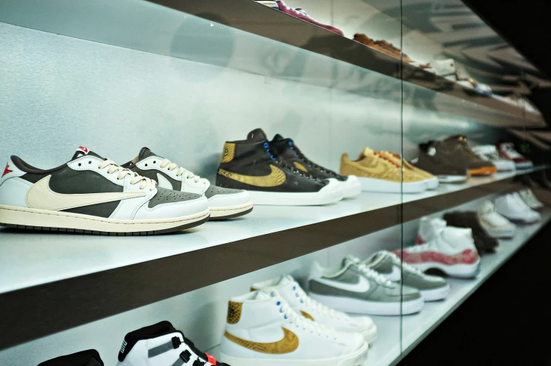a bunch of different types of shoes sitting on shelves