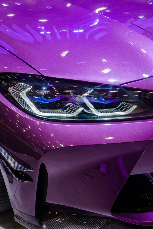 a purple car in the showroom for the public