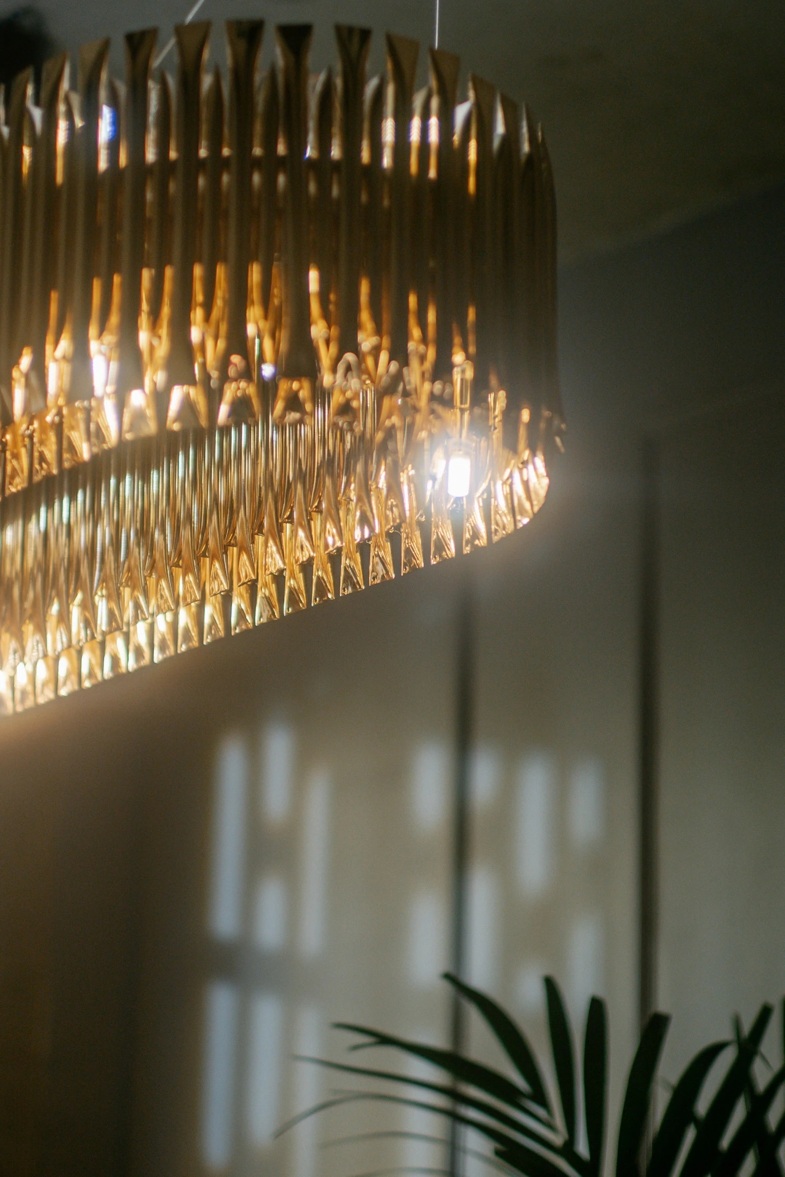 a chandelier hanging from a ceiling covered in lamps