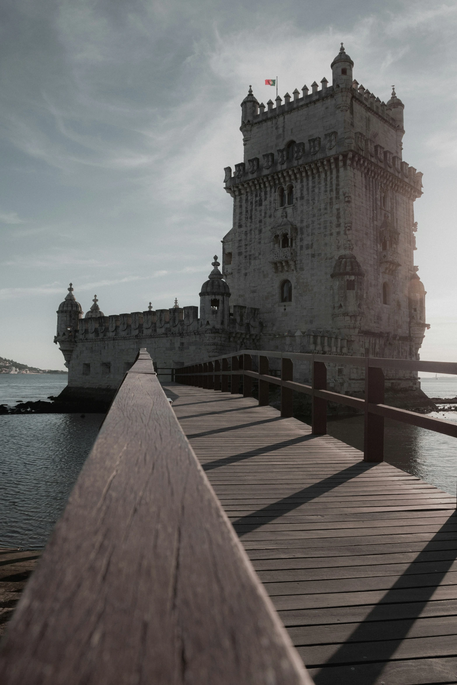 the pier is lined with buildings and overlooking the water