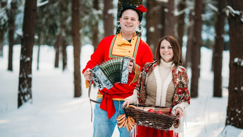 a man in an indian garb stands next to a woman