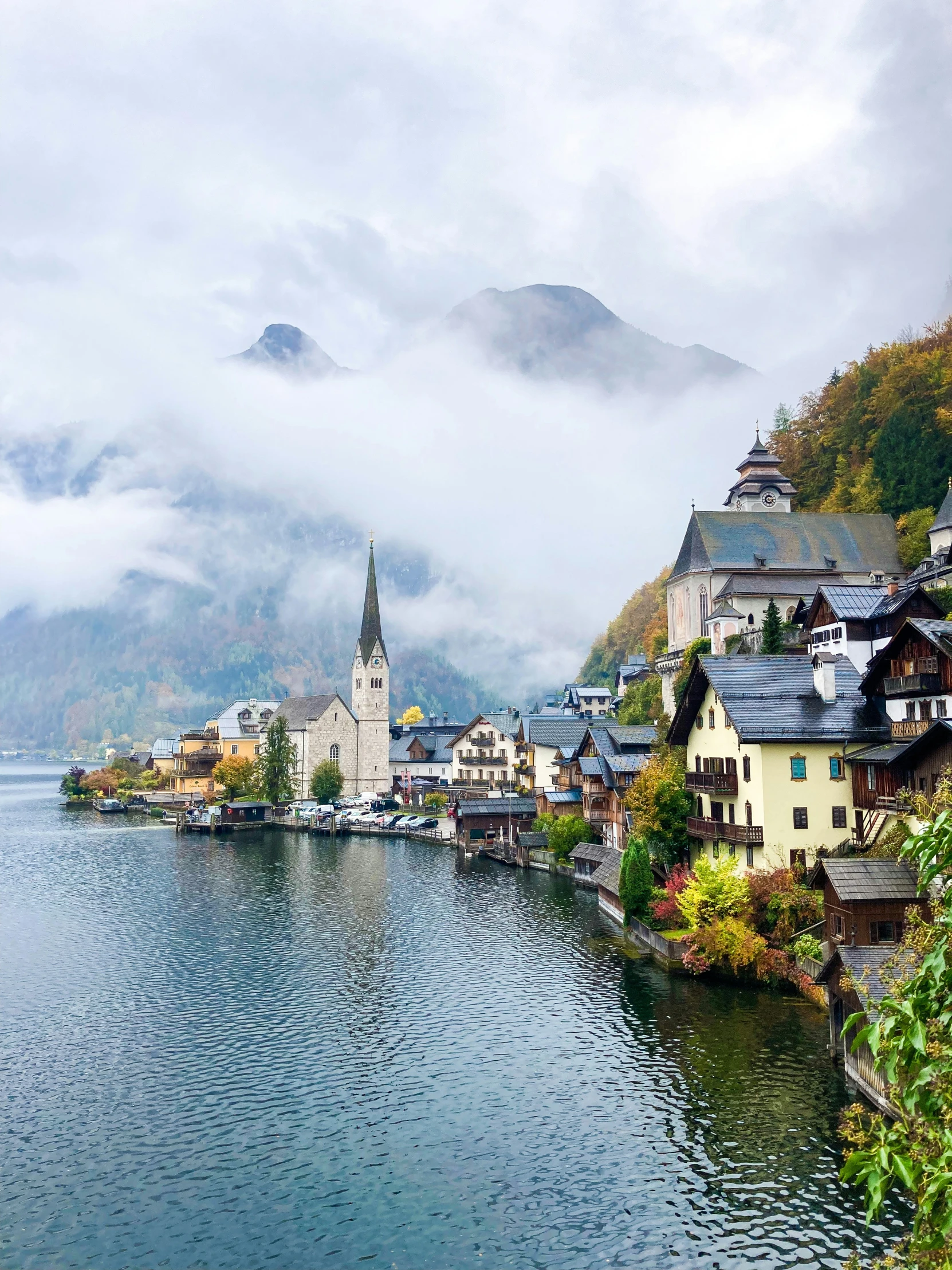 a view of the village on the water's edge from across the lake