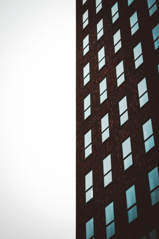 a tall building with some windows all over it