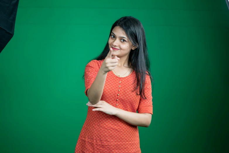 woman posing with her fingers to the side