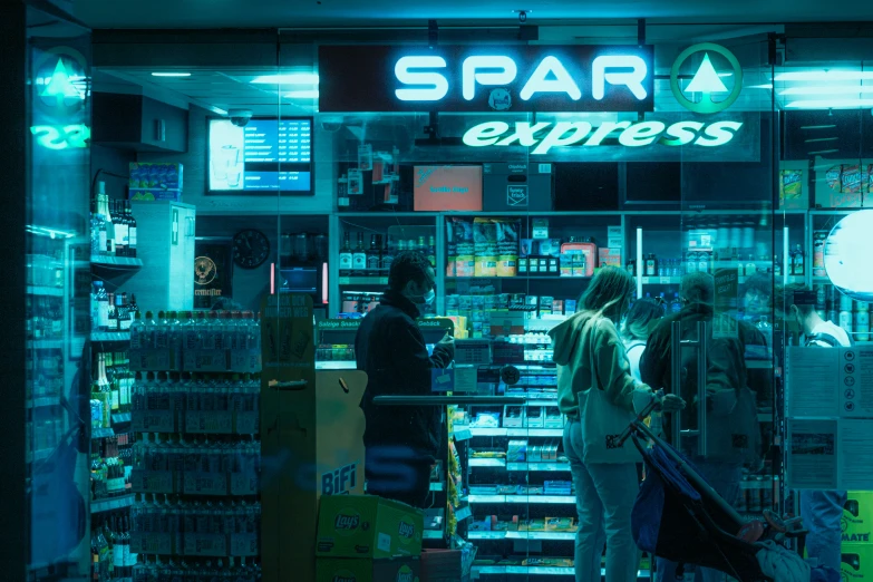 a store front with a lighted store front sign and the words spar express