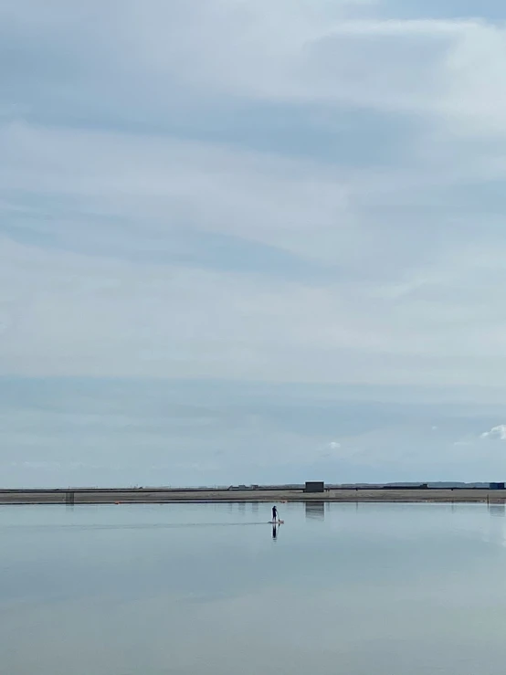 a lighthouse on the water's edge during the day