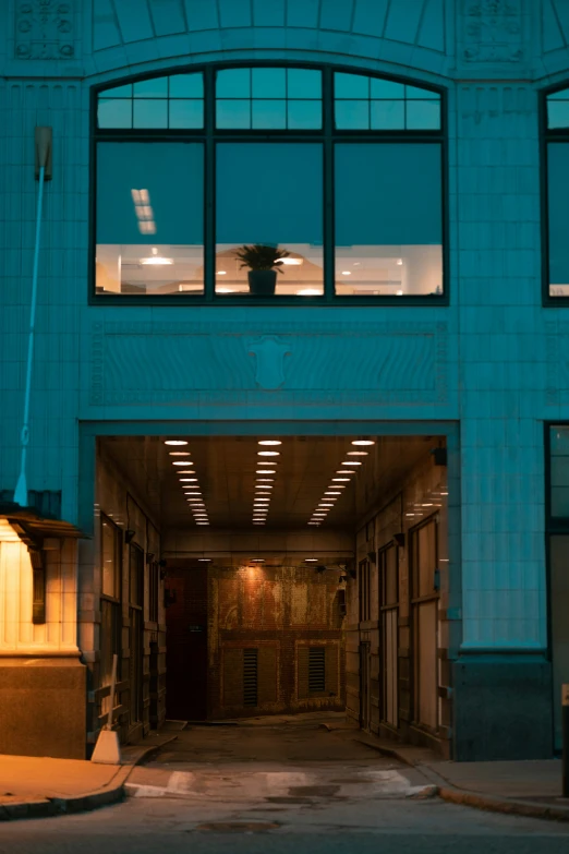 a blue building with some open windows