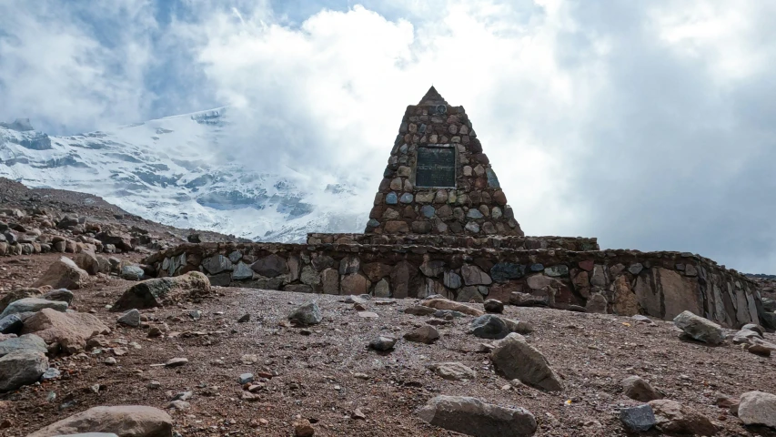 a view of a mountain peak with a window in the middle