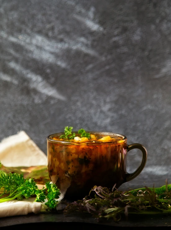 a green and brown cup on some type of counter