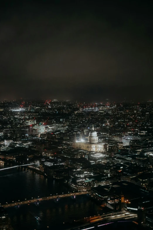 aerial view of cityscape at night showing large lights