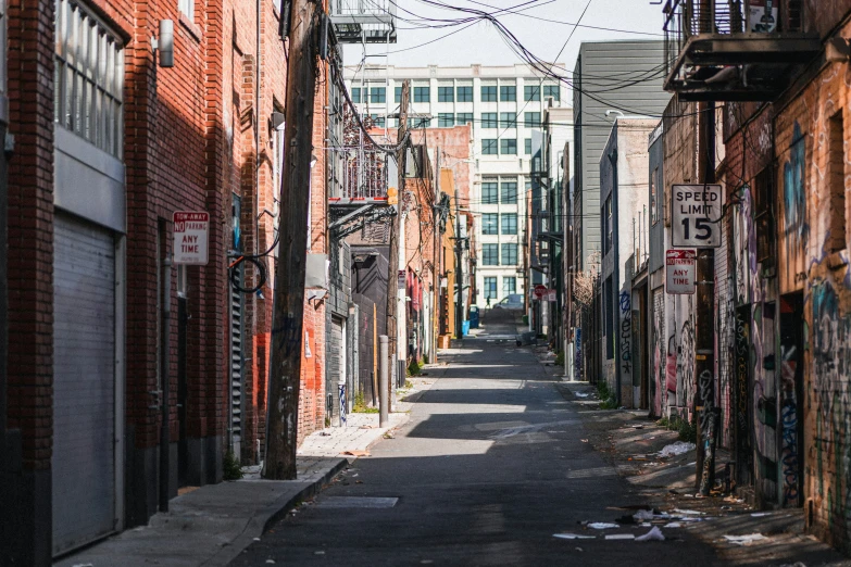 a street that has some graffiti on the building