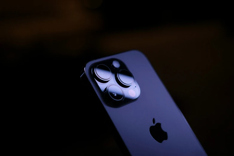 a blue iphone with the face of an evil person