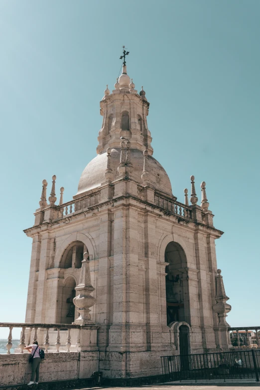 a person standing in front of a church