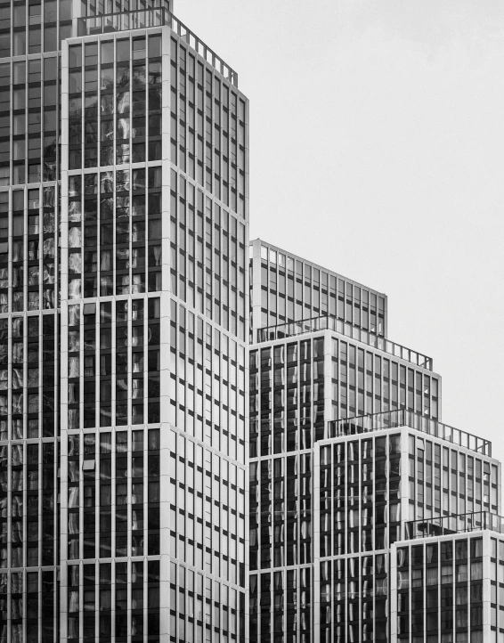 a row of tall buildings with balconies on top