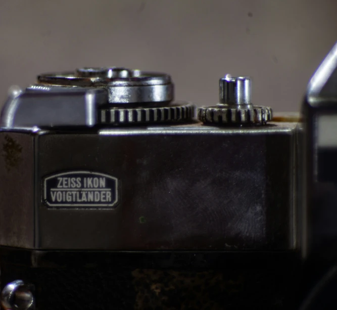 the gears on an old style analog video camera