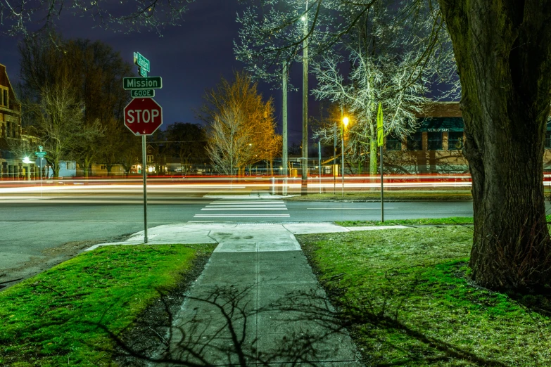 a stop sign at an intersection on a street corner