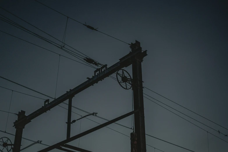 a clock tower next to the power lines