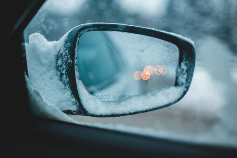 a car rear view mirror with the light on