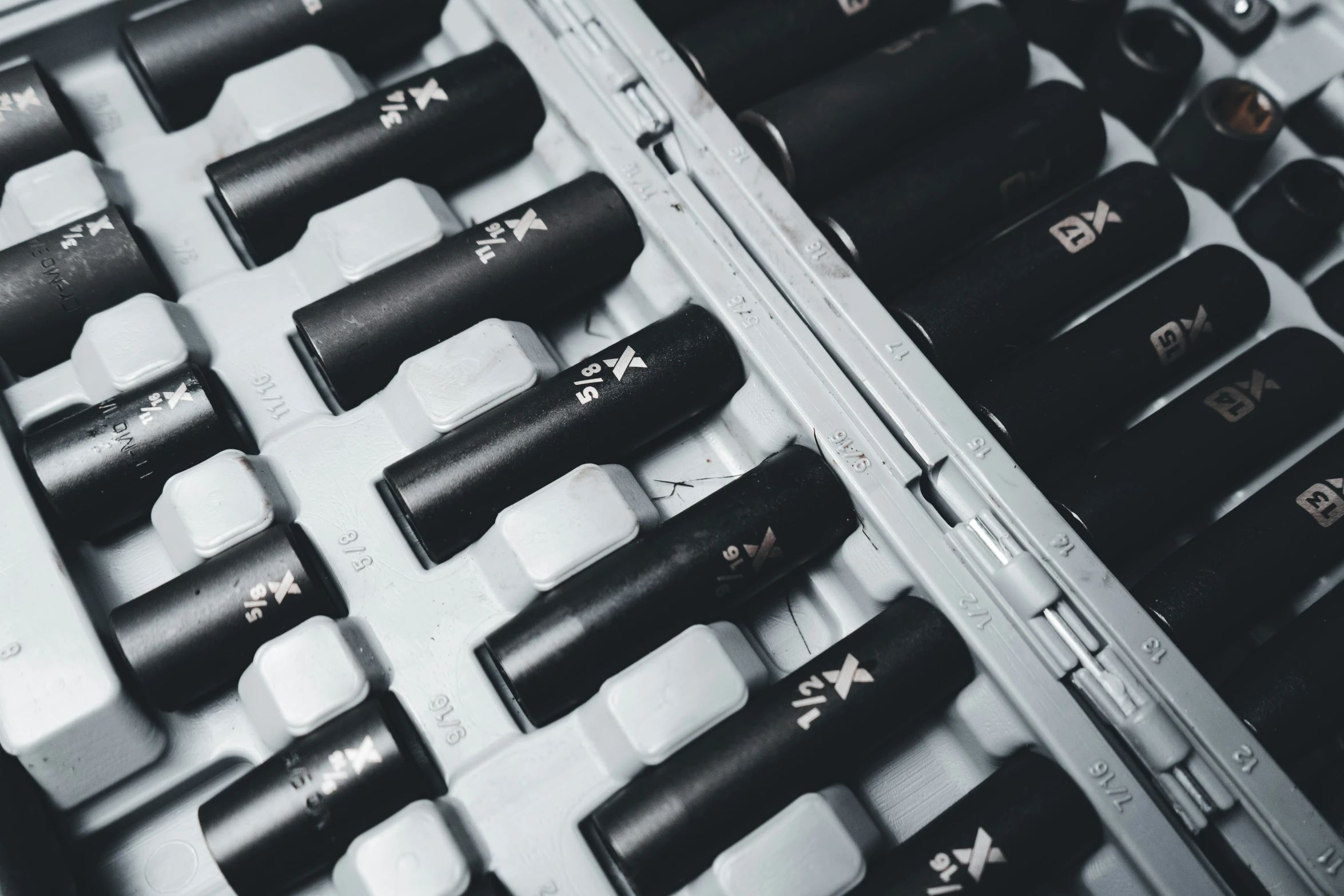 a row of black and white types of keys