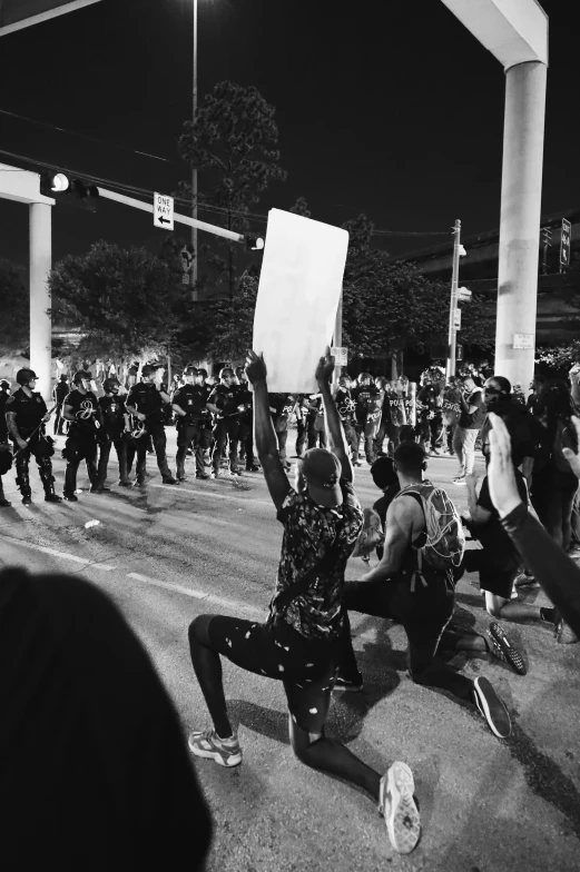 a group of people protesting on the street