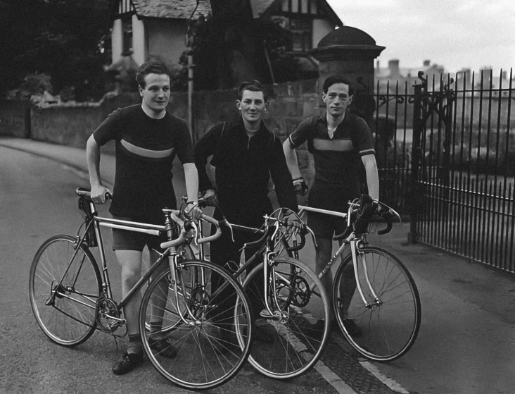 the three men are posing with their bikes