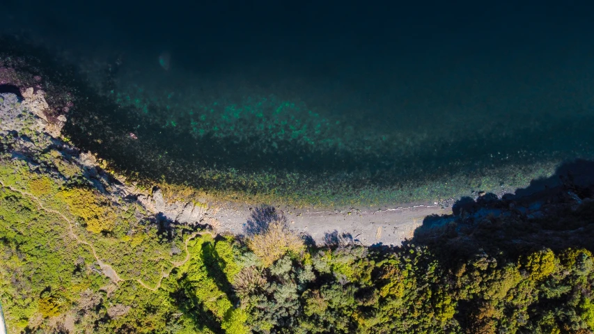 aerial s of an area surrounded by green mountains