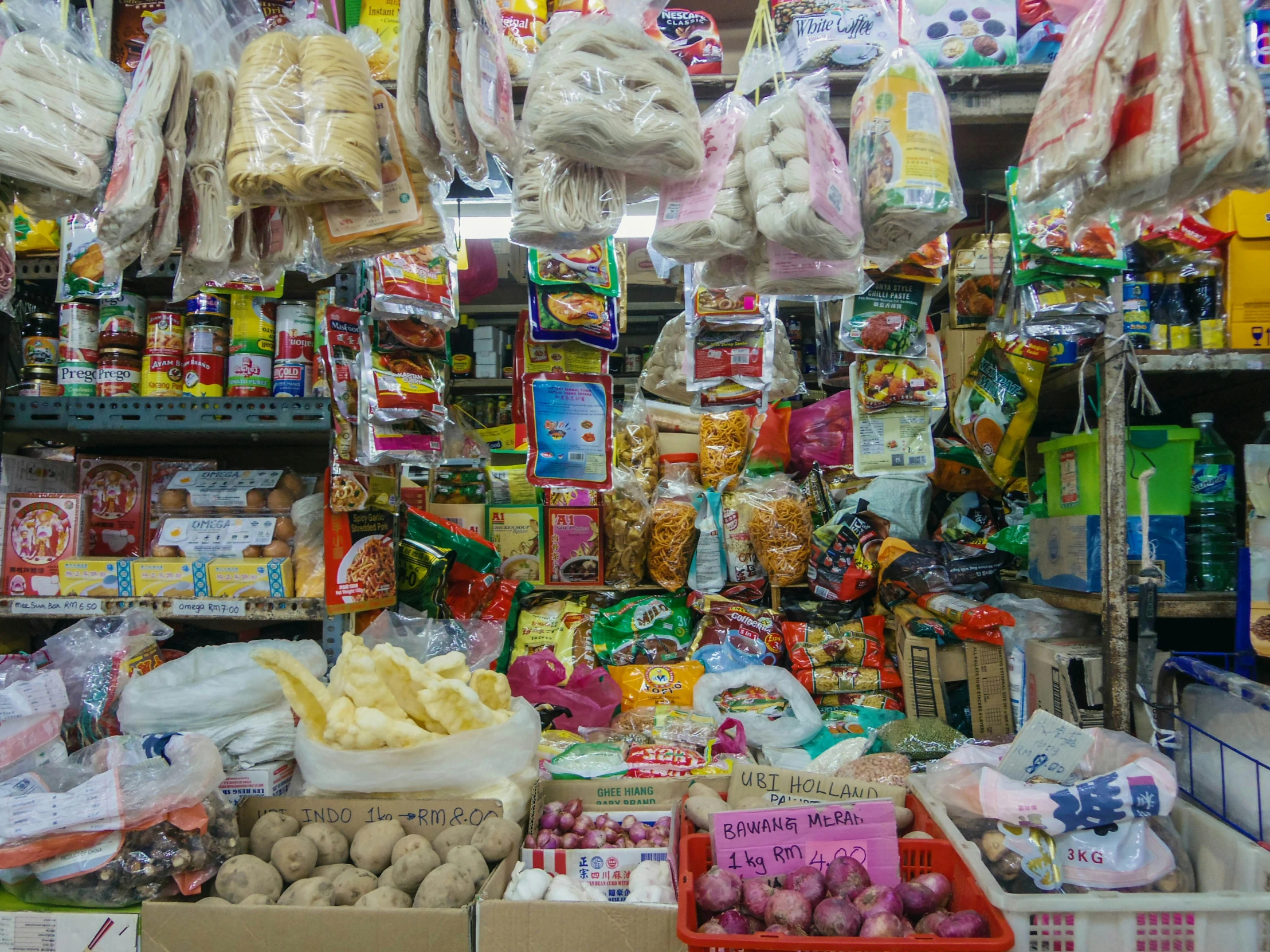 assortment of bags and food items in shop with display