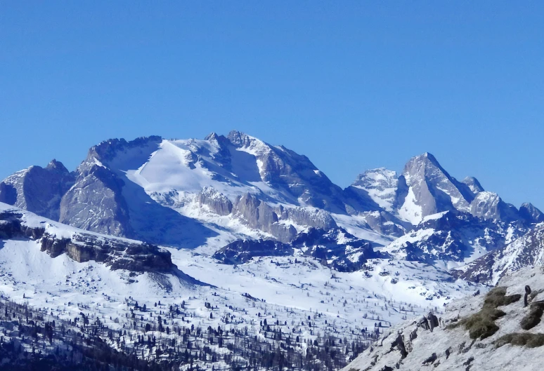 the mountains are covered with white snow