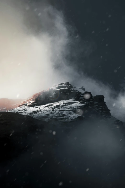 a snow covered mountain is shown with mountains and fog