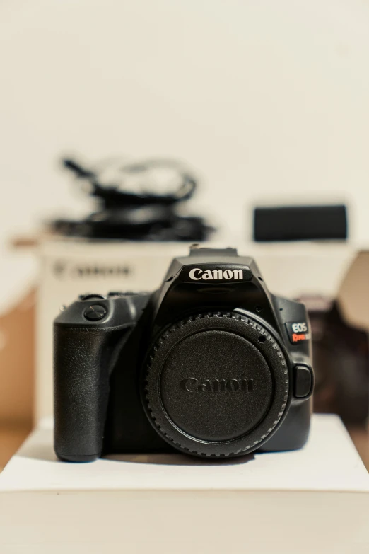 camera sitting on top of a white table