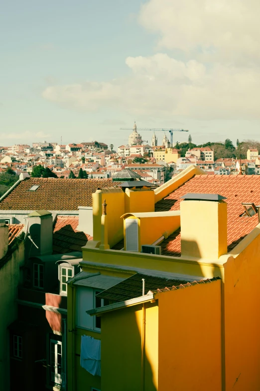 yellow rooftops in a city area with a brown roof