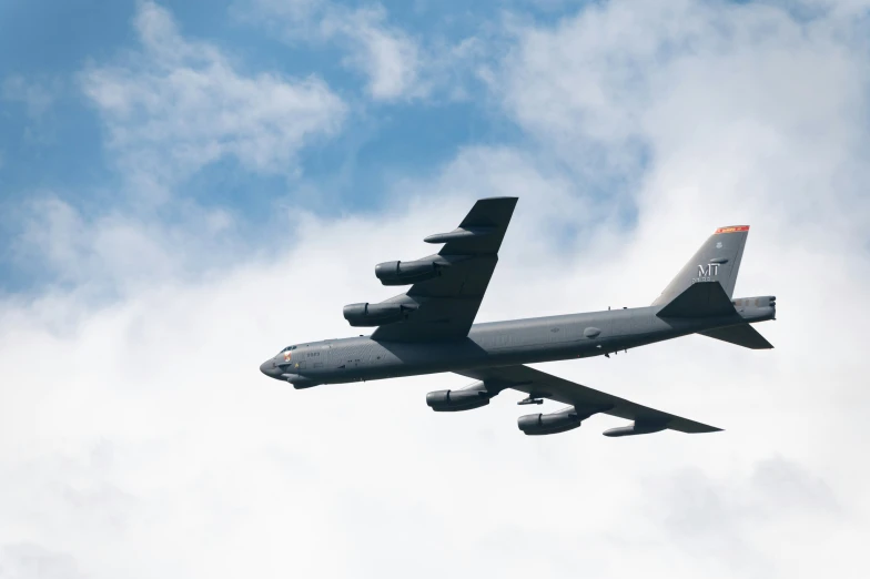 the underside view of a commercial airplane in flight